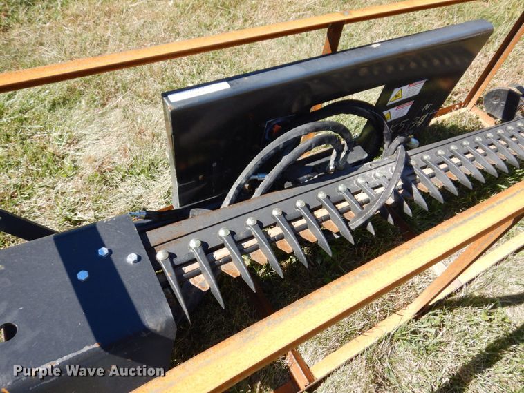 image for item JL9932 Wolverine  skid steer sickle mower