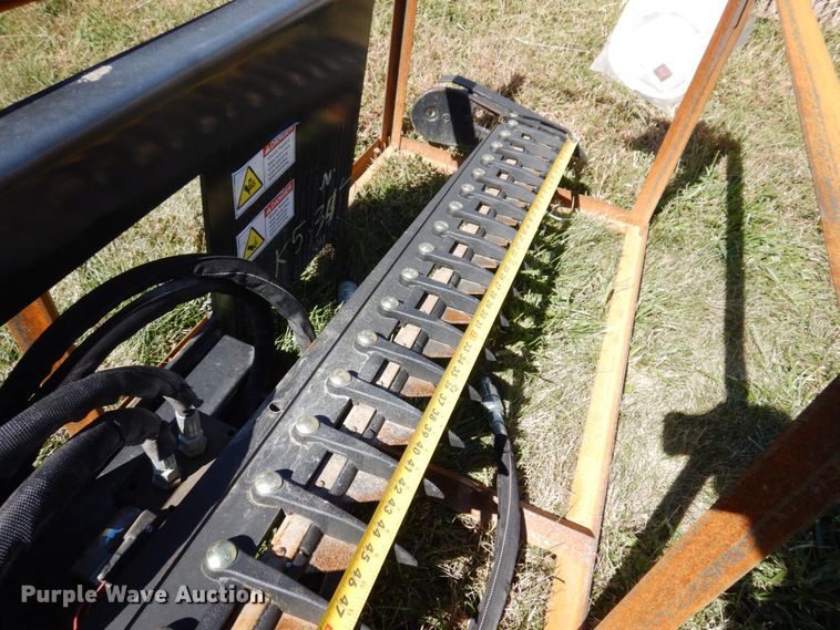 image for item JL9932 Wolverine  skid steer sickle mower