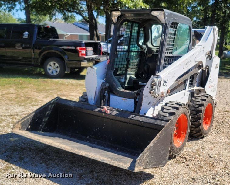 image for item LM9750 2015 Bobcat S590  skid steer loader