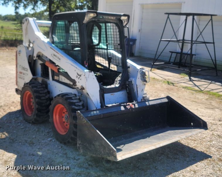 image for item LM9750 2015 Bobcat S590  skid steer loader