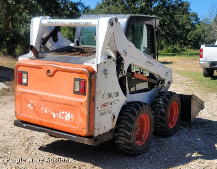 image for item LM9750 2015 Bobcat S590  skid steer loader