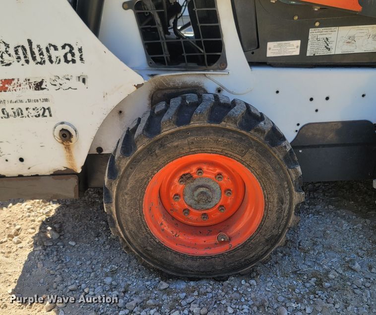image for item LM9750 2015 Bobcat S590  skid steer loader