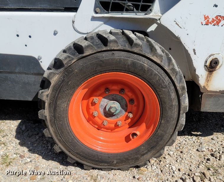 image for item LM9750 2015 Bobcat S590  skid steer loader