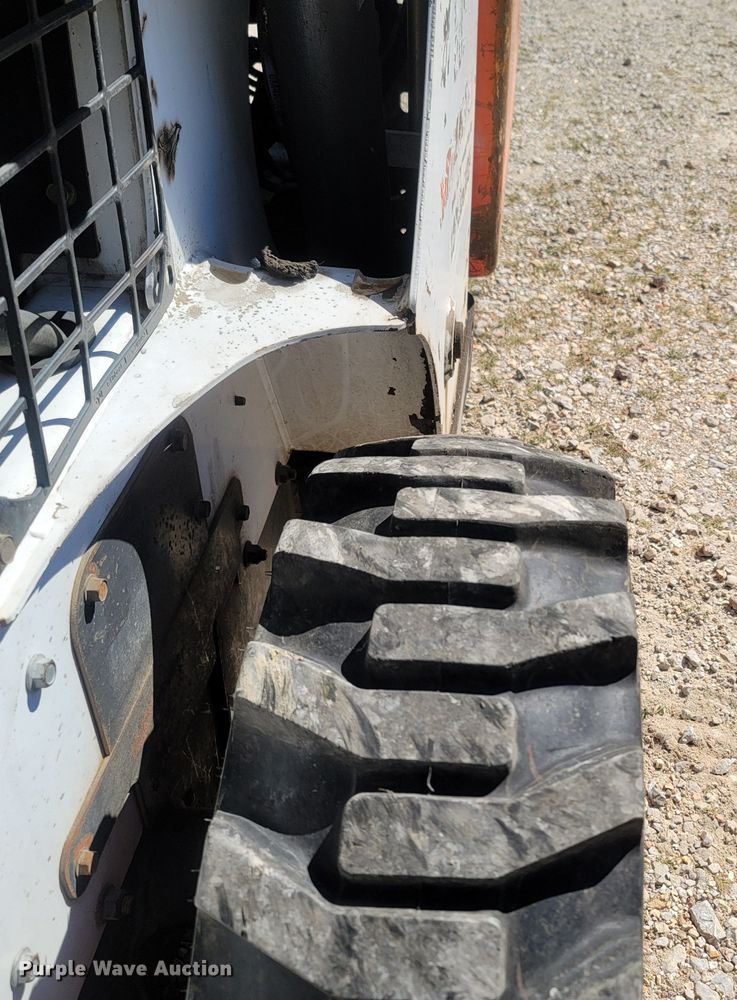 image for item LM9750 2015 Bobcat S590  skid steer loader