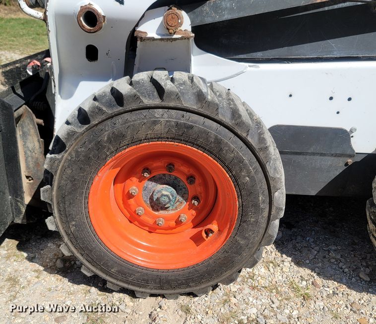 image for item LM9750 2015 Bobcat S590  skid steer loader