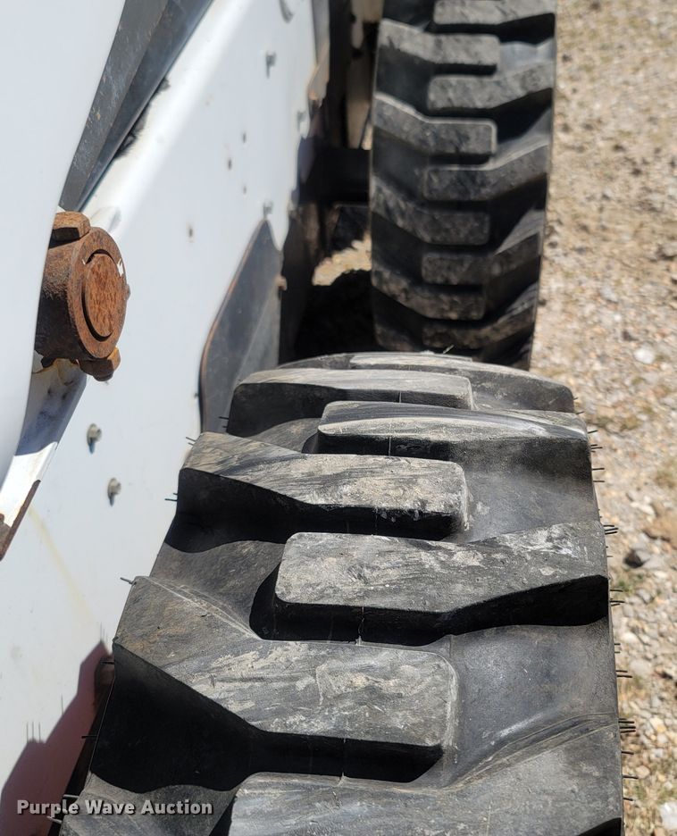 image for item LM9750 2015 Bobcat S590  skid steer loader