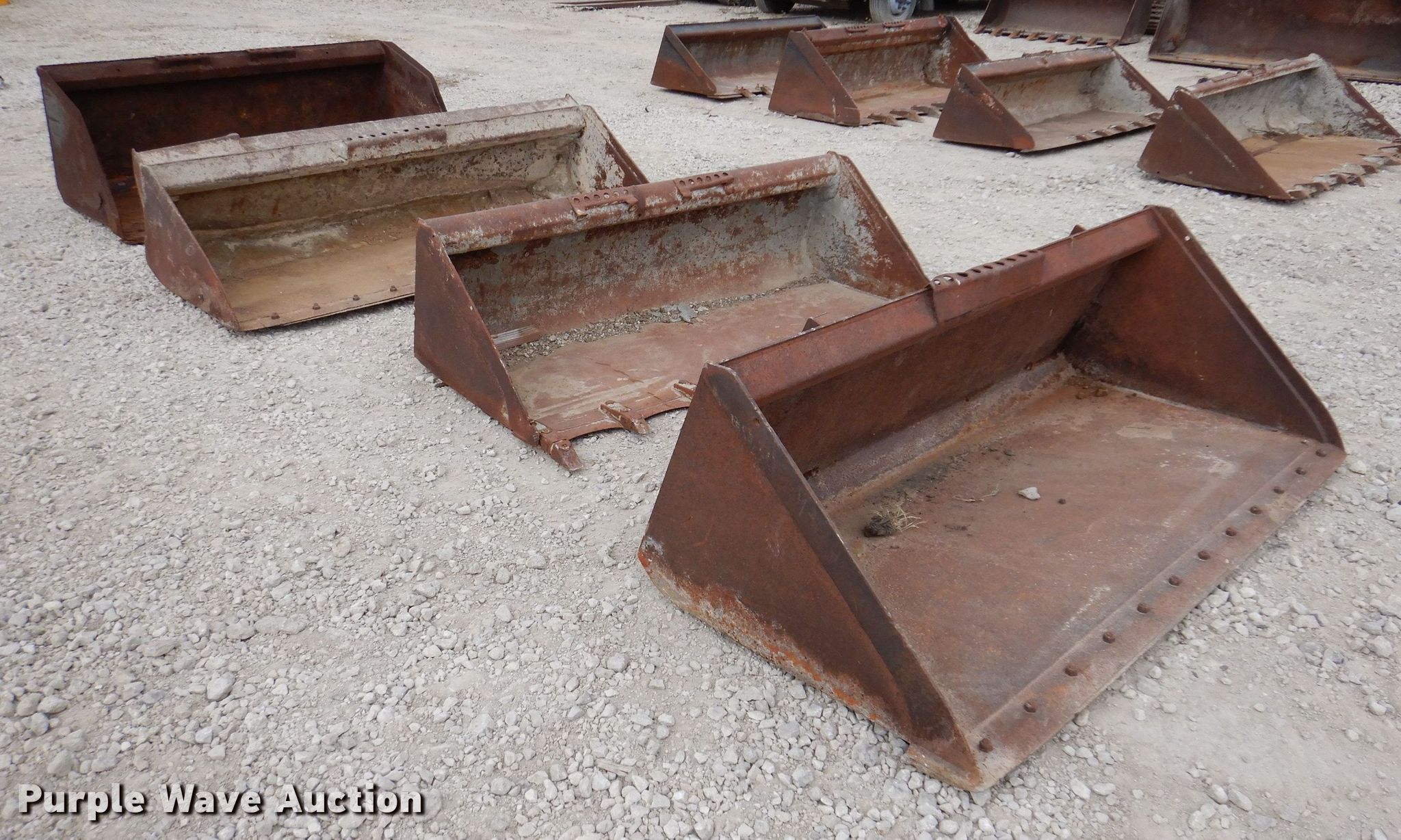 (4) skid steer buckets in Anita, IA Item KW9414 sold Purple Wave