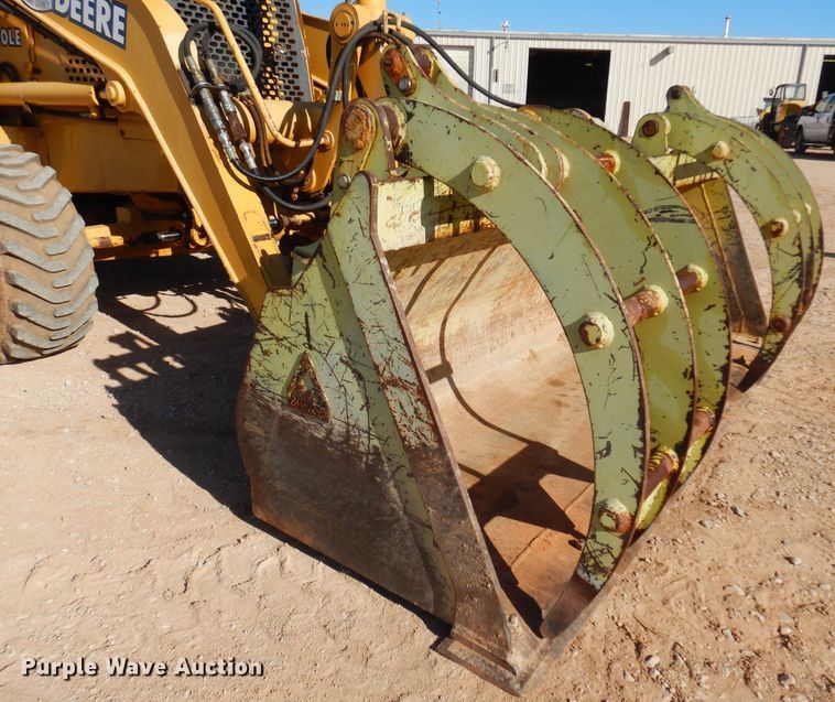 image for item KO9815 2001 John Deere 210LE  landscape tractor