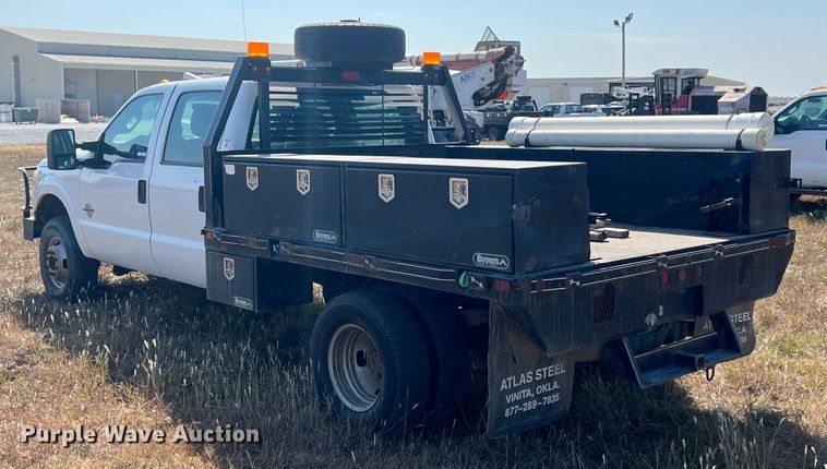 image for item KF9900 2012 Ford F350 Super Duty  Crew Cab flatbed pickup truck