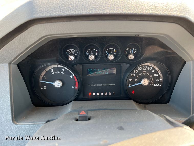 image for item KF9900 2012 Ford F350 Super Duty  Crew Cab flatbed pickup truck