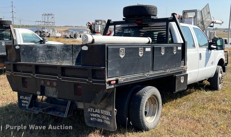 image for item KF9902 2015 Ford F350 Super Duty  Crew Cab flatbed pickup truck