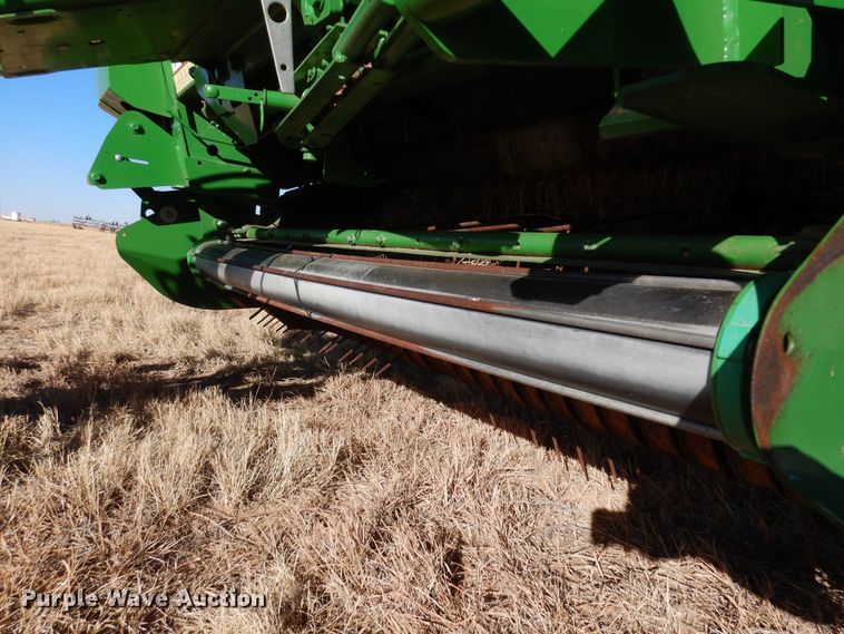 image for item DF8210 2014 John Deere 569 Premium  round baler