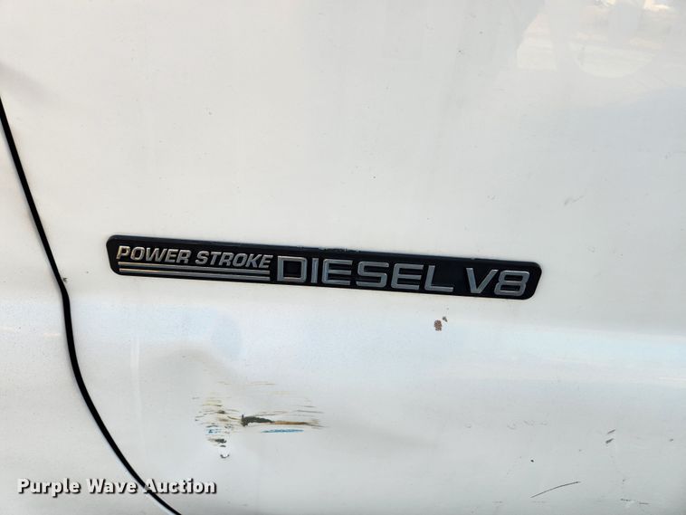 image for item JB9707 2002 Ford F350 Super Duty  Crew Cab flatbed pickup truck