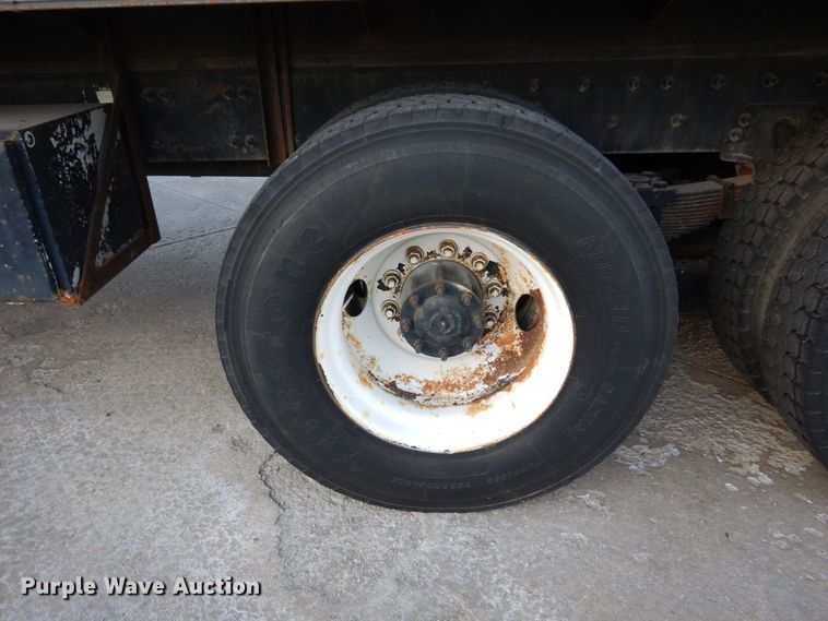 image for item JL9769 2004 Freightliner FL80  flatbed truck