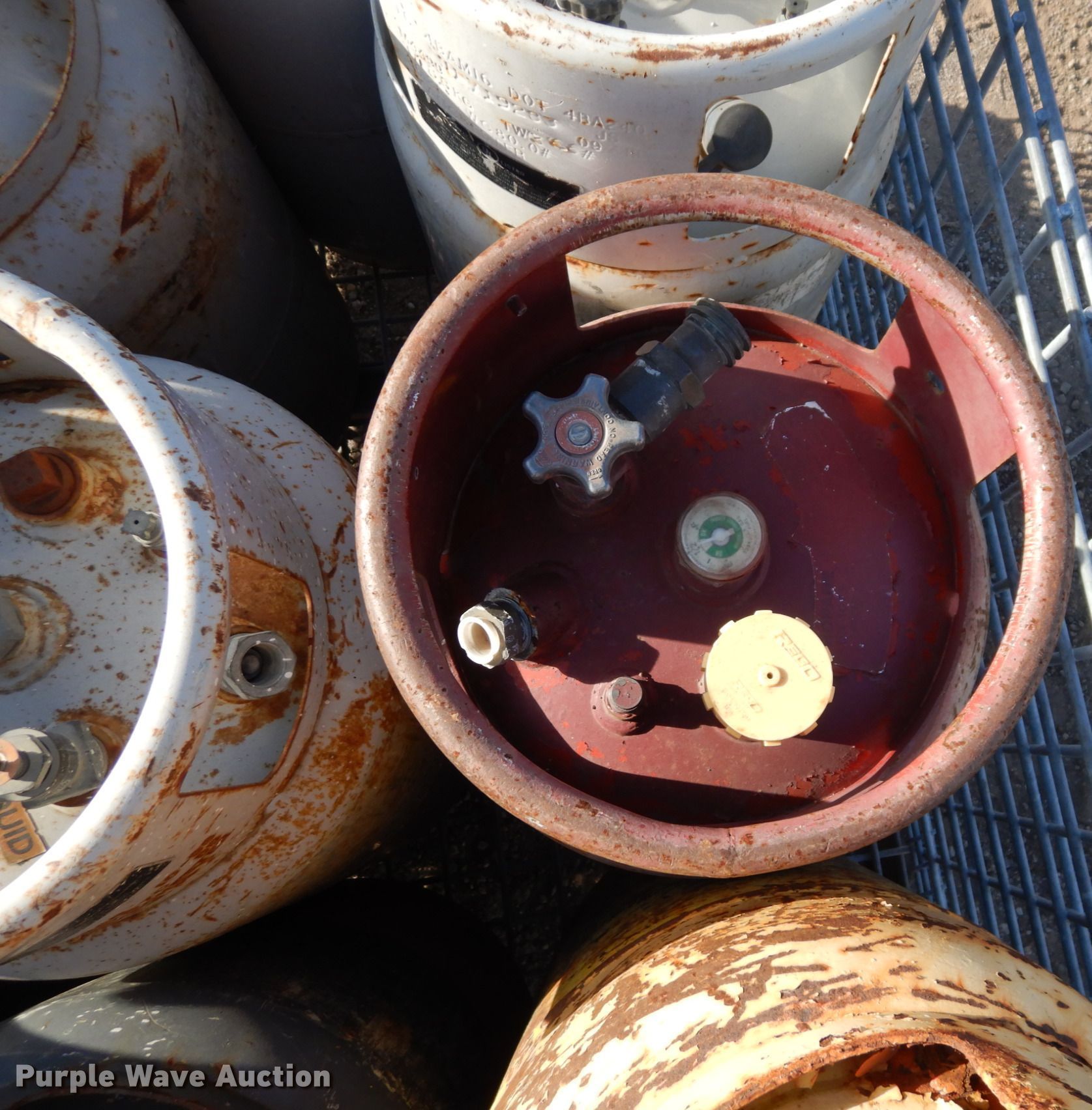 Approximately 9 steel propane tanks in Lawrence, KS Item LY9188 sold