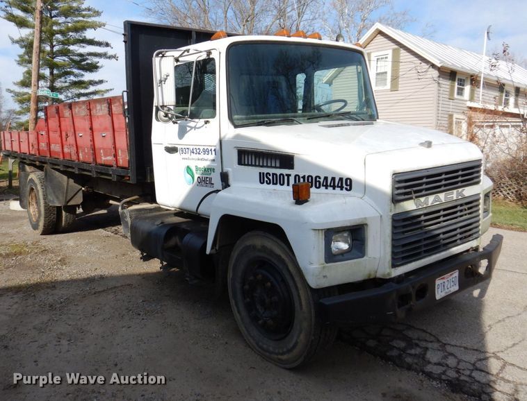 image for item JL9759 1997 Mack CS300P  dump flatbed truck