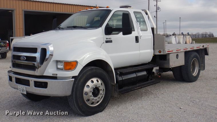 image for item DP0415 2015 Ford F750 Super Duty XLT  SuperCab flatbed truck