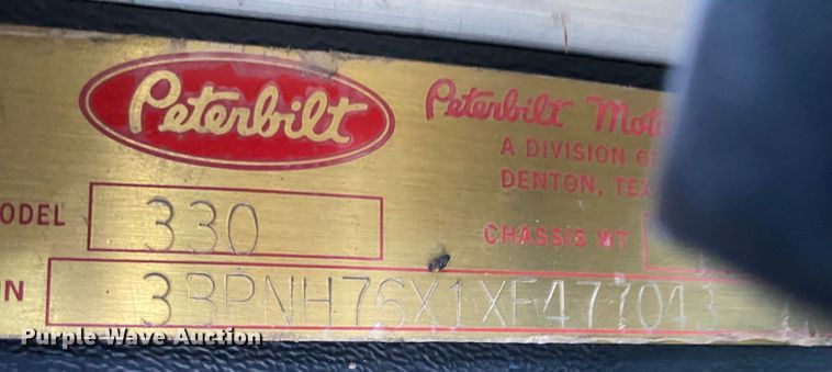 image for item DN8108 1999 Peterbilt 330 flatbed truck