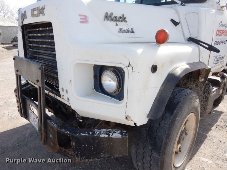 image for item DS1532 1991 Mack DM690S  roll-off container truck