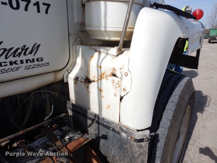 image for item DS1532 1991 Mack DM690S  roll-off container truck