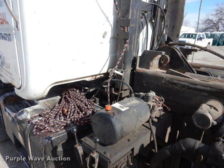 image for item DS1532 1991 Mack DM690S  roll-off container truck