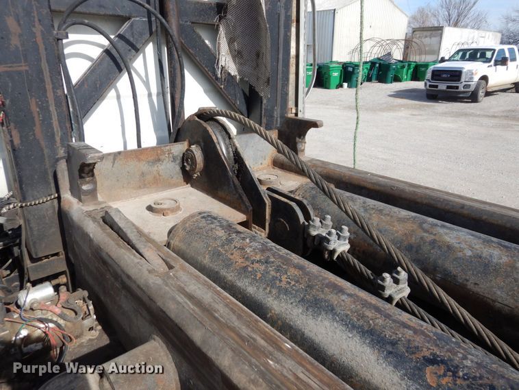 image for item DS1532 1991 Mack DM690S  roll-off container truck