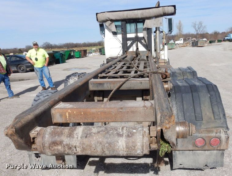 image for item DS1532 1991 Mack DM690S  roll-off container truck