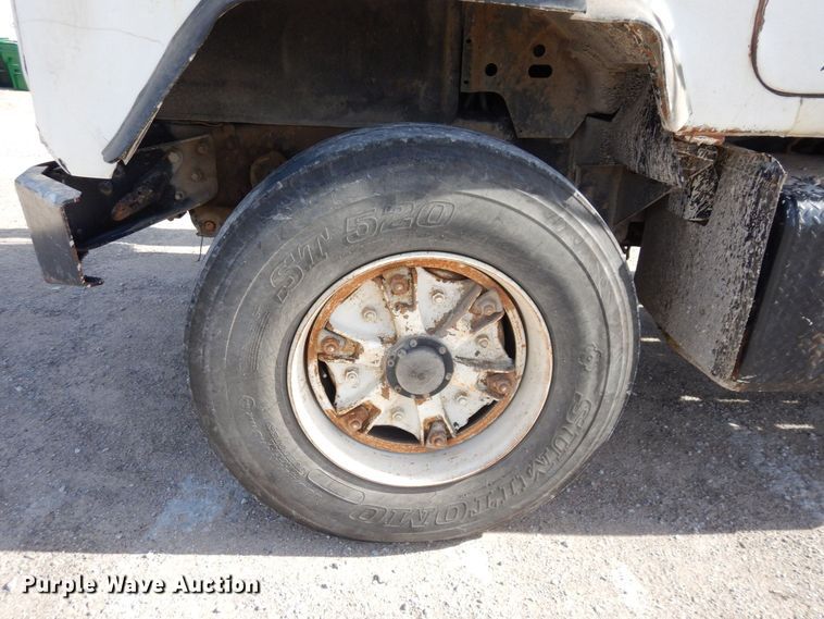 image for item DS1532 1991 Mack DM690S  roll-off container truck