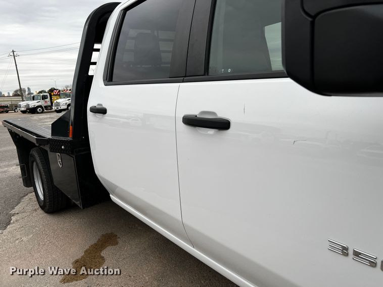 image for item DQ1953 2021 Chevrolet Silverado 3500HD  Crew Cab flatbed pickup truck