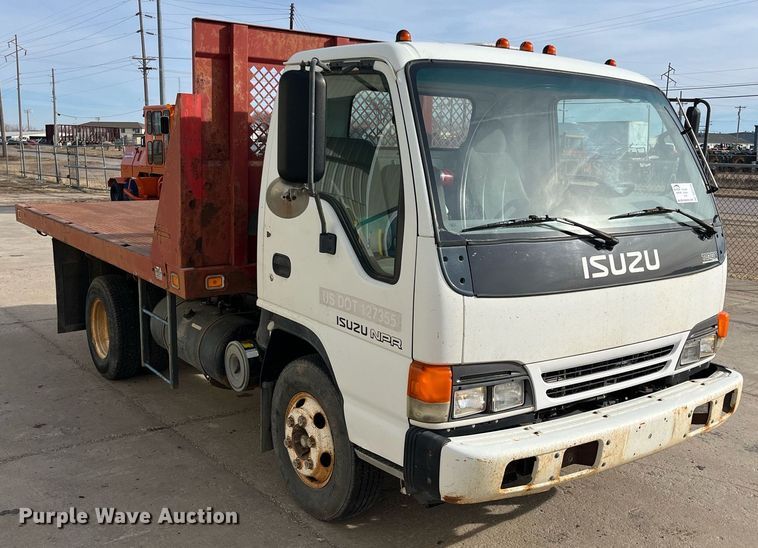 image for item DQ5119 1999 Isuzu NPR  dump flatbed truck