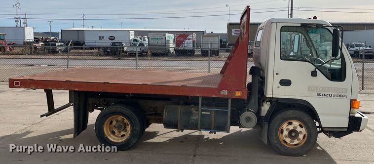 image for item DQ5119 1999 Isuzu NPR  dump flatbed truck