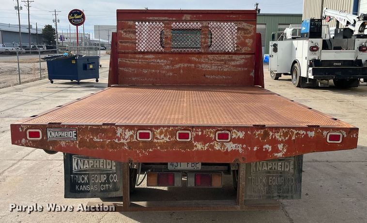 image for item DQ5119 1999 Isuzu NPR  dump flatbed truck