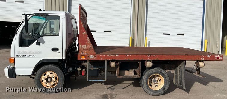 image for item DQ5119 1999 Isuzu NPR  dump flatbed truck