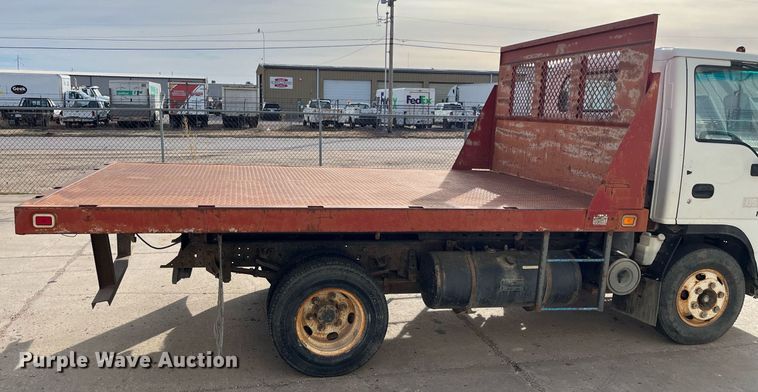 image for item DQ5119 1999 Isuzu NPR  dump flatbed truck