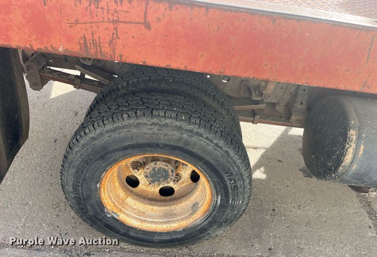 image for item DQ5119 1999 Isuzu NPR  dump flatbed truck