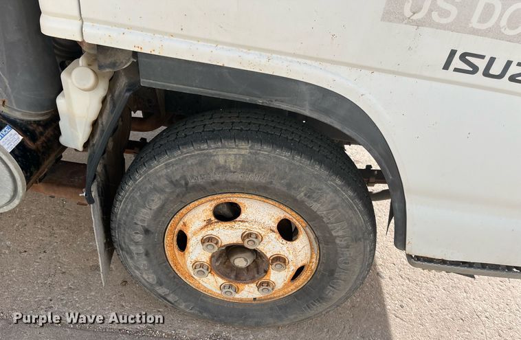 image for item DQ5119 1999 Isuzu NPR  dump flatbed truck