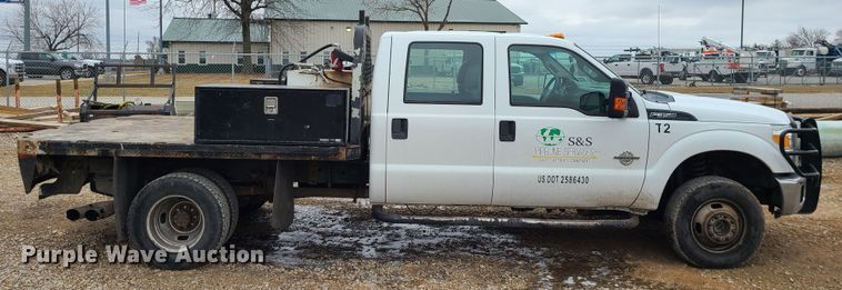 image for item JW9772 2013 Ford F350 Super Duty  Crew Cab flatbed pickup truck