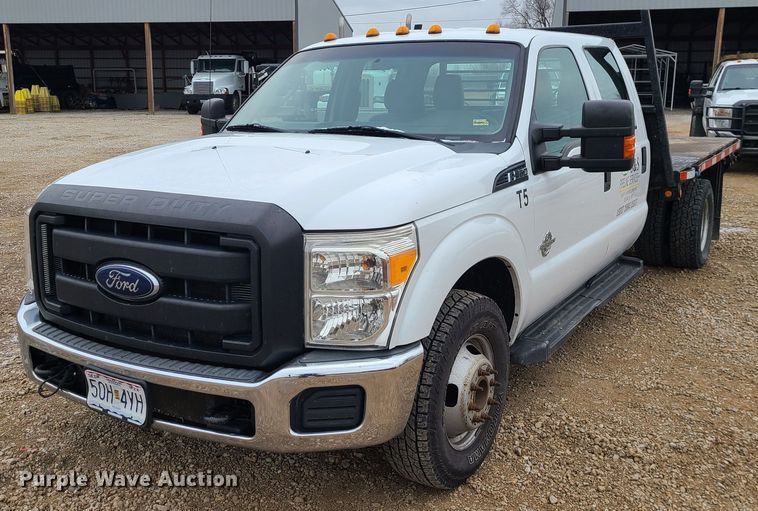image for item JW9773 2014 Ford F350 Super Duty  Crew Cab flatbed pickup truck