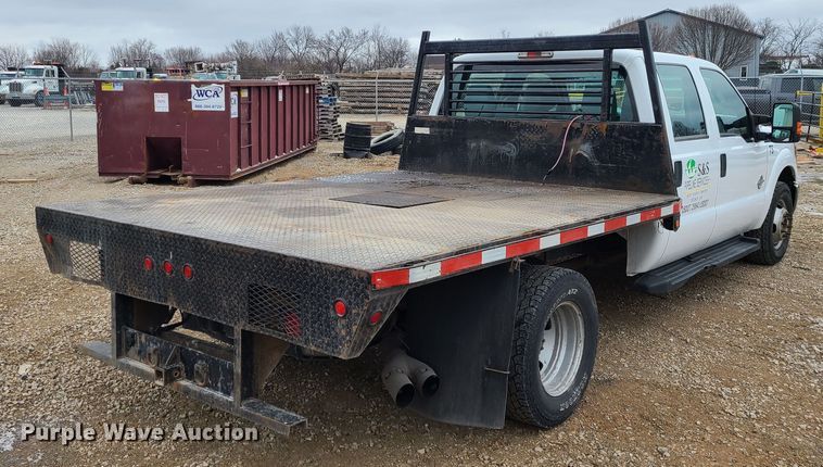 image for item JW9773 2014 Ford F350 Super Duty  Crew Cab flatbed pickup truck