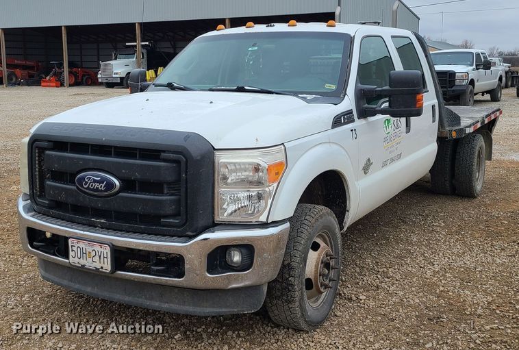 image for item JW9775 2012 Ford F350 Super Duty  Crew Cab flatbed pickup truck