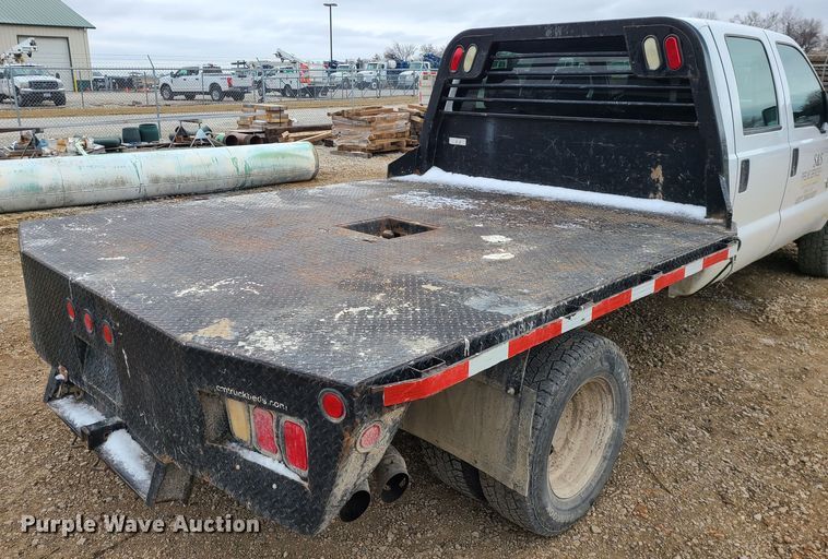 image for item JW9775 2012 Ford F350 Super Duty  Crew Cab flatbed pickup truck