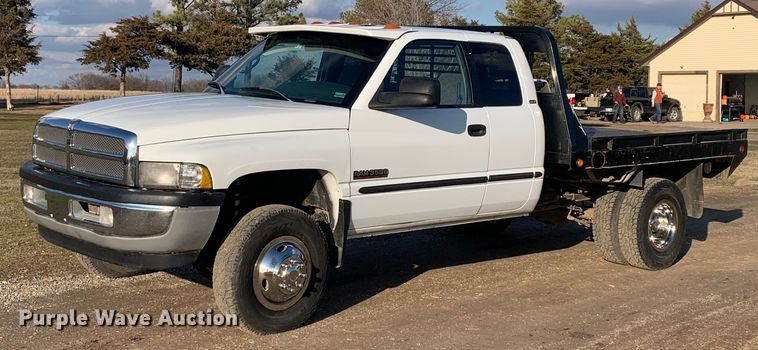 image for item MM9709 1999 Dodge Ram 3500  Quad Cab flatbed pickup truck
