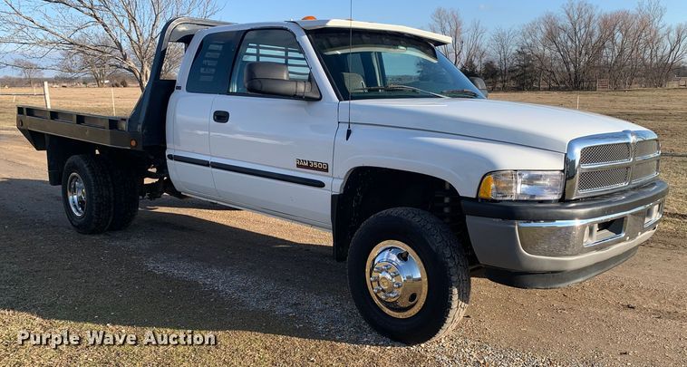 image for item MM9709 1999 Dodge Ram 3500  Quad Cab flatbed pickup truck