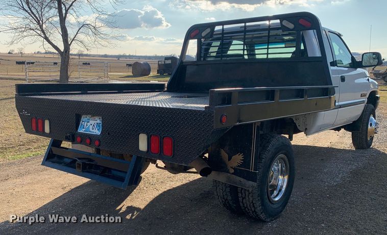 image for item MM9709 1999 Dodge Ram 3500  Quad Cab flatbed pickup truck