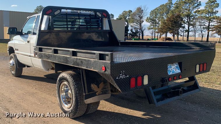 image for item MM9709 1999 Dodge Ram 3500  Quad Cab flatbed pickup truck