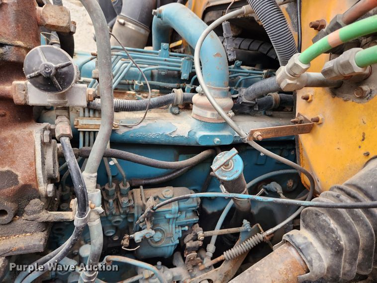 image for item KT9370 1990 International 4900  flatbed truck with forklift