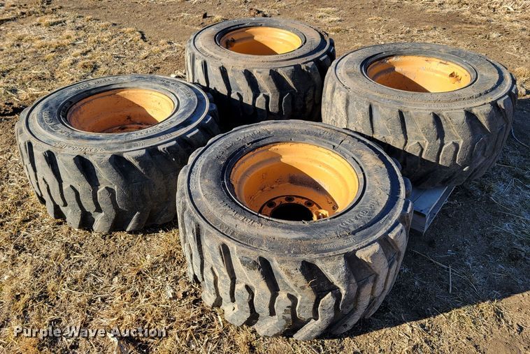 image for item MC9537 (4) 33x15.5-16.5 skid steer tires and wheels