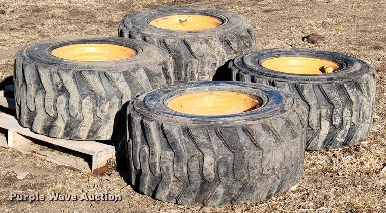 image for item MC9537 (4) 33x15.5-16.5 skid steer tires and wheels