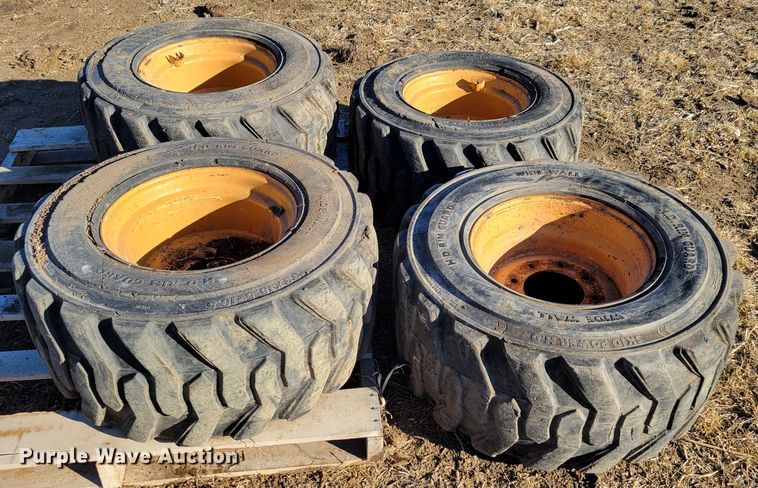 image for item MC9537 (4) 33x15.5-16.5 skid steer tires and wheels