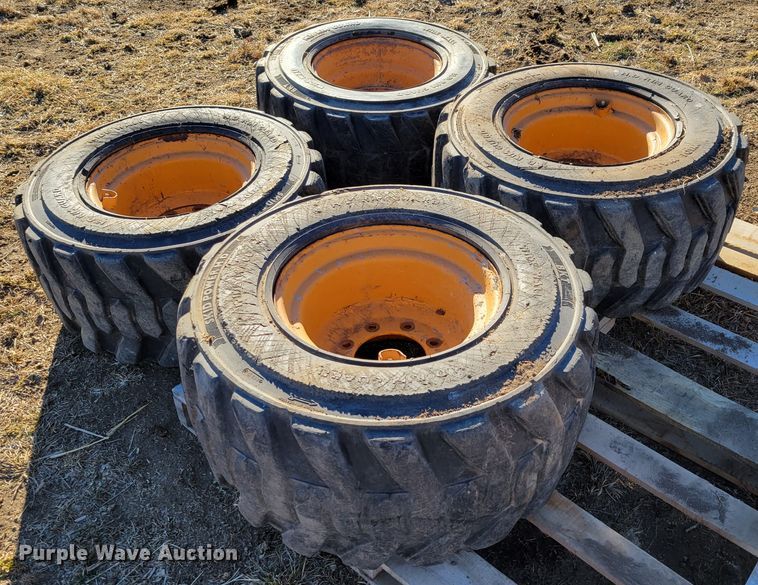 image for item MC9537 (4) 33x15.5-16.5 skid steer tires and wheels